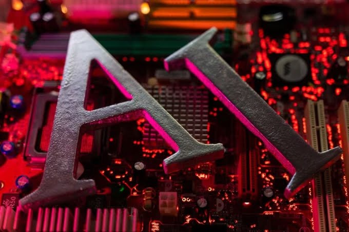 The AI symbol is placed on the computer motherboard. Photo: Reuters